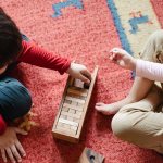 How can a teacher develop the speech of preschoolers through play?